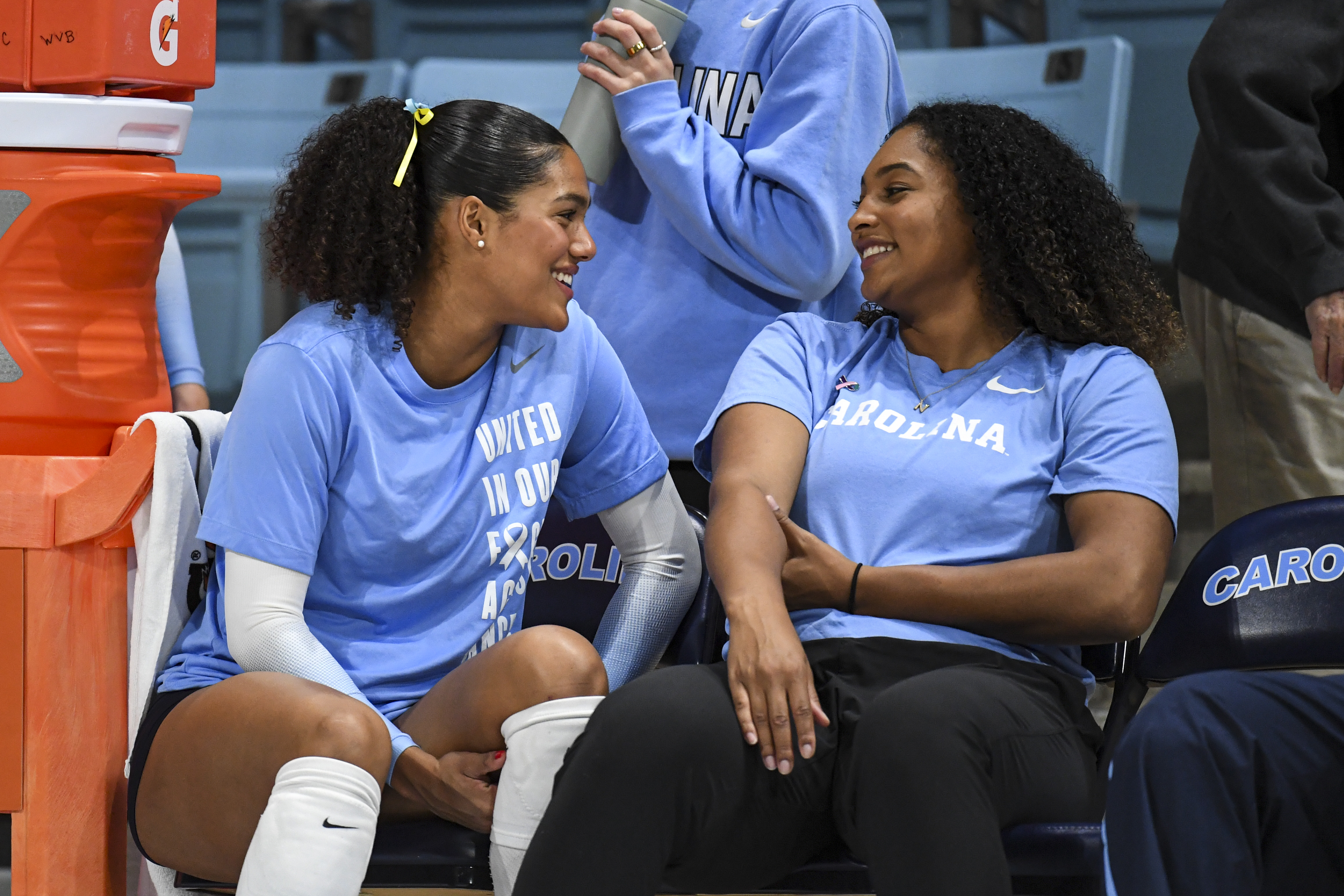 Jackie comforting her assistant coach before a game on the side line